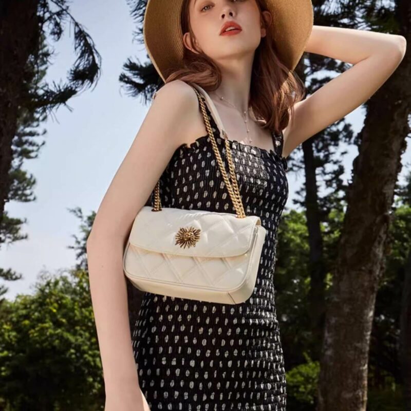 sun god split leather quilted shoulder bag with chain model look